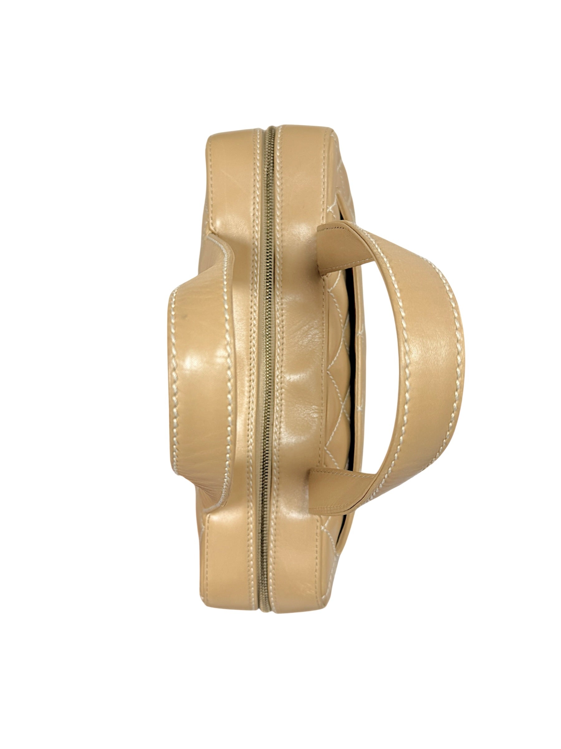 Overhead profile of Chanel Surpique Bowler bag highlighting shape and structured silhouette.
