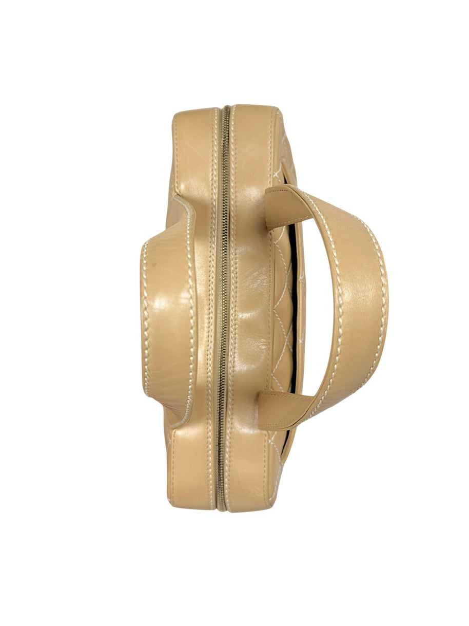 Overhead profile of Chanel Surpique Bowler bag highlighting shape and structured silhouette.