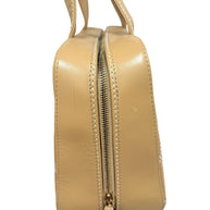 Close-up side detail of Chanel Surpique Bowler bag showing quilting, lambskin leather texture and zipper construction.
