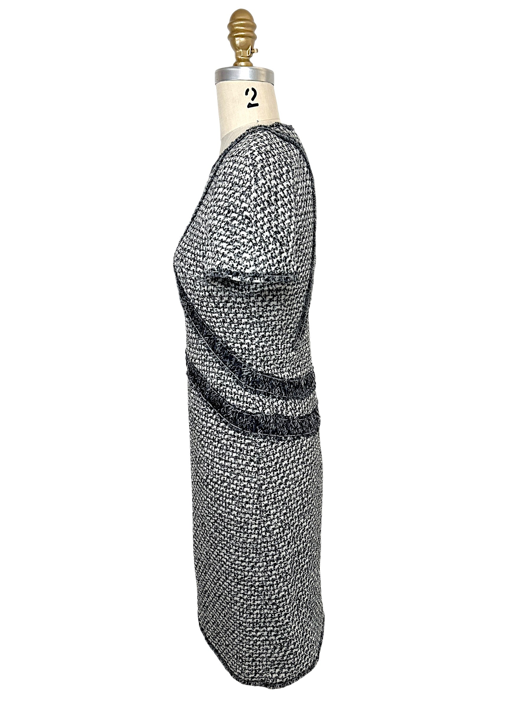 Right side profile of Chanel black and white tweed dress