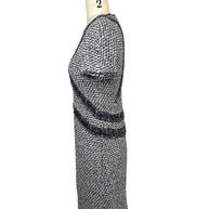 Right side profile of Chanel black and white tweed dress