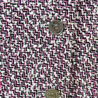 Macro detail of Chanel pink black and white tweed weave with silver-tone CC buttons from Spring 1996 collection