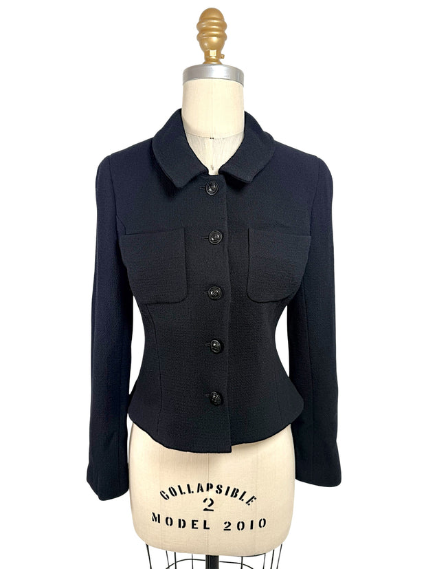 Vintage Chanel Boutique black cropped jacket with CC logo buttons and tailored waist front view