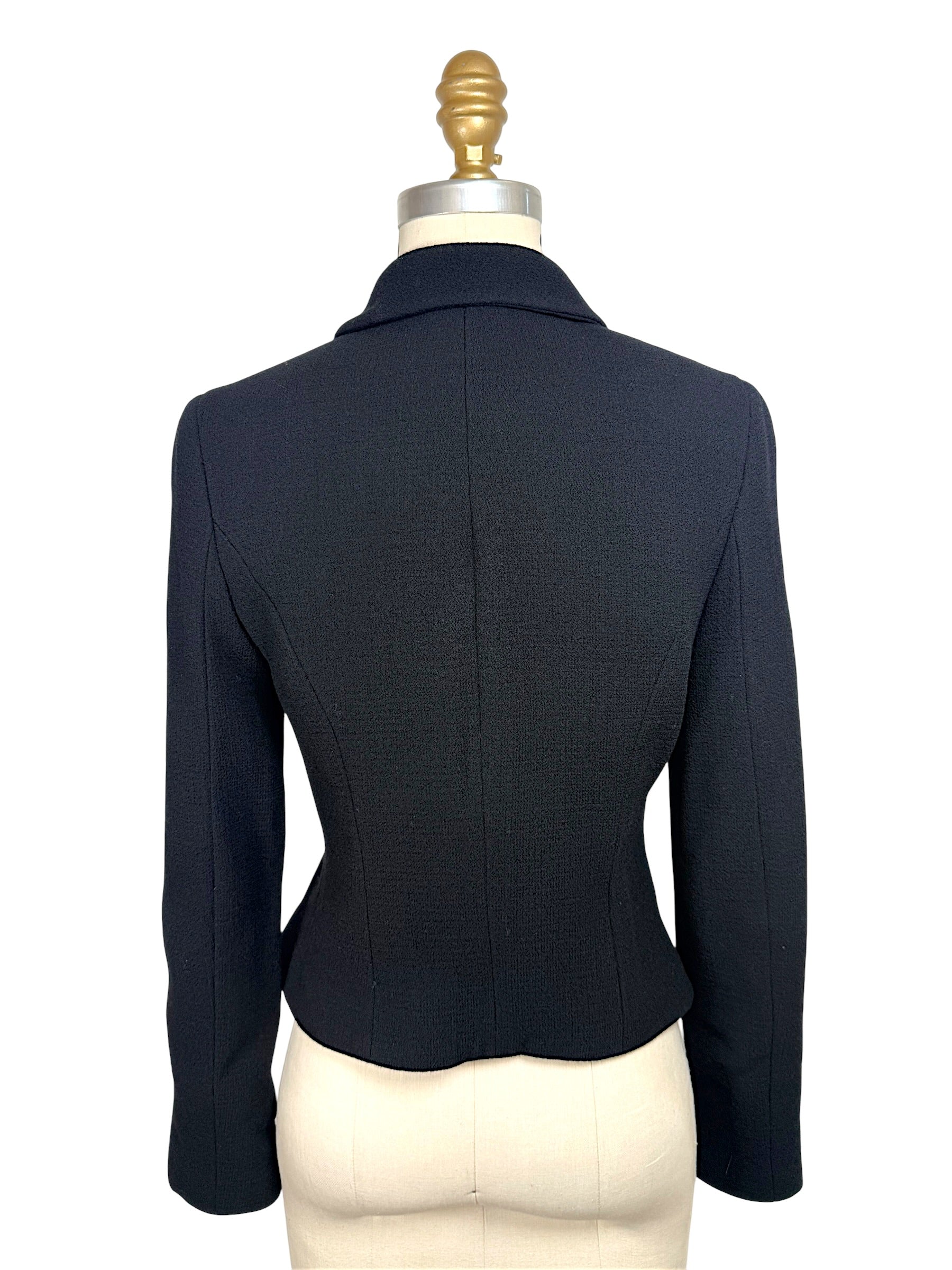 Back view of vintage Chanel Boutique black tailored cropped jacket with fitted silhouette