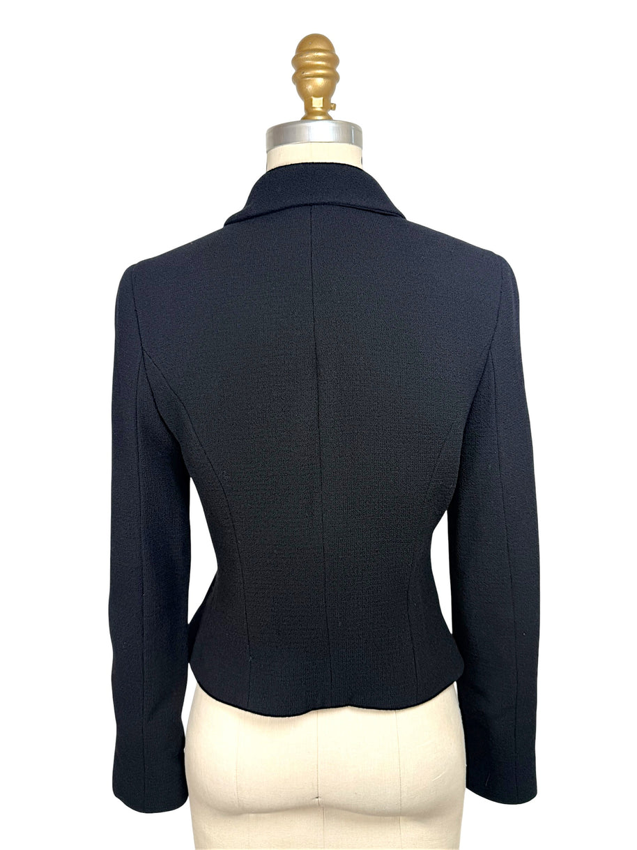 Back view of vintage Chanel Boutique black tailored cropped jacket with fitted silhouette