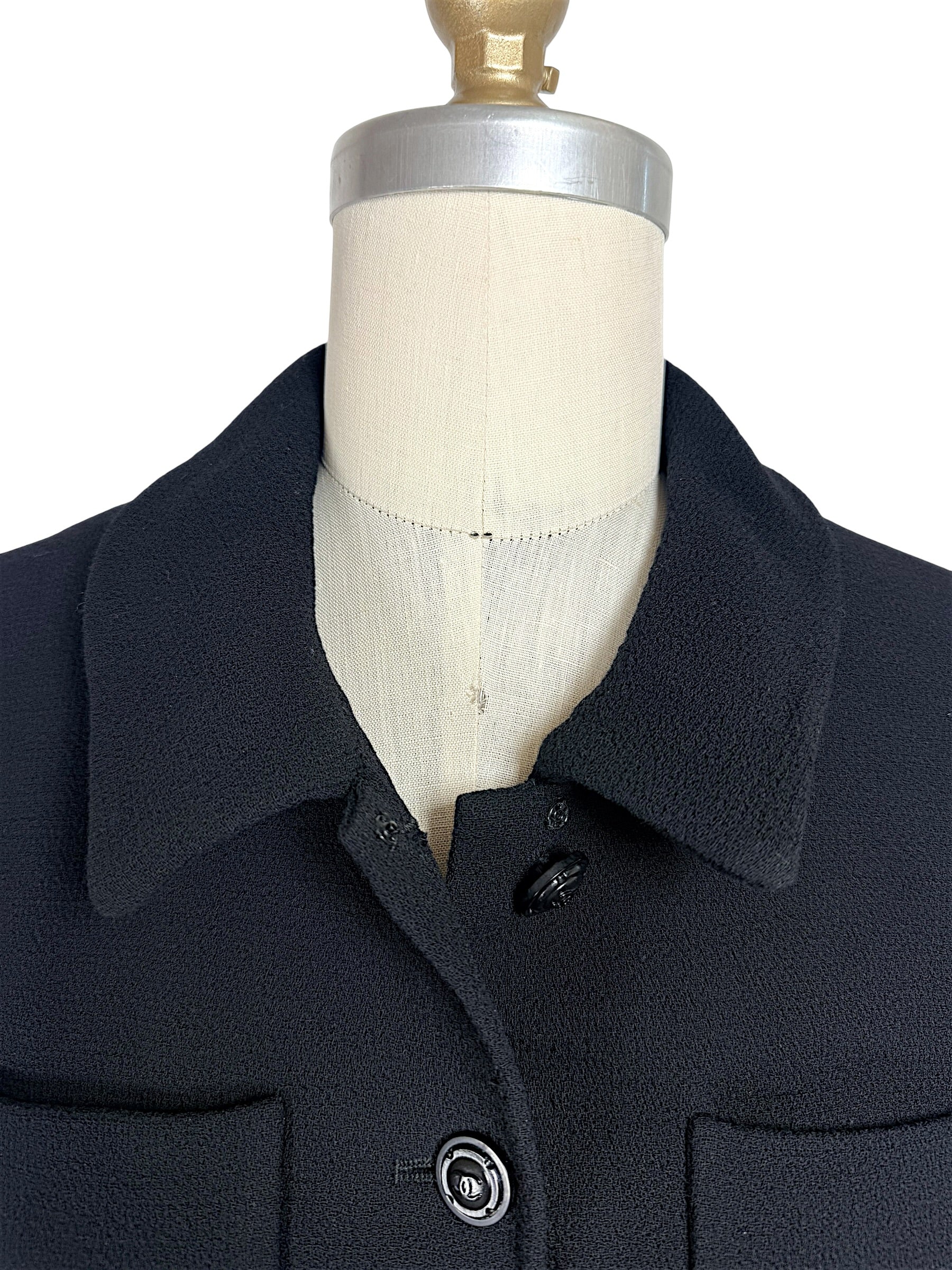 Close-up of rounded collar detail on vintage Chanel black cropped jacket