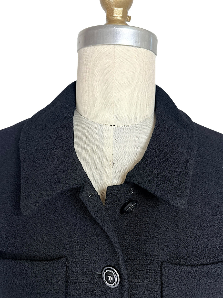 Close-up of rounded collar detail on vintage Chanel black cropped jacket