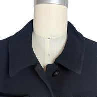 Close-up of rounded collar detail on vintage Chanel black cropped jacket