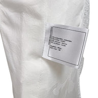 Fabric composition tag inside Chanel white bouclé tweed dress with silk lining and metallic trim