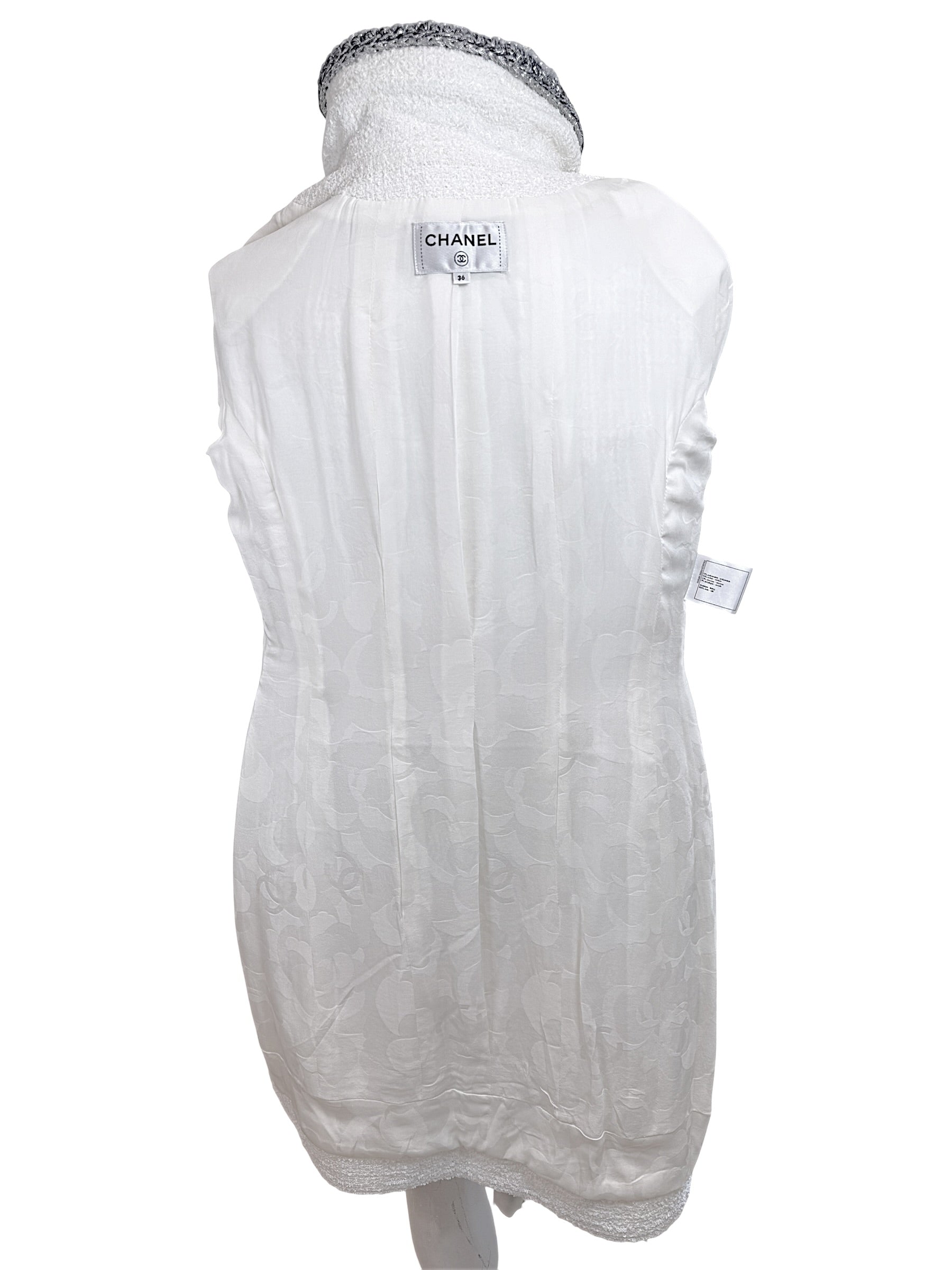 Full interior view of Chanel white bouclé tweed dress with signature silk CC jacquard lining and label detail