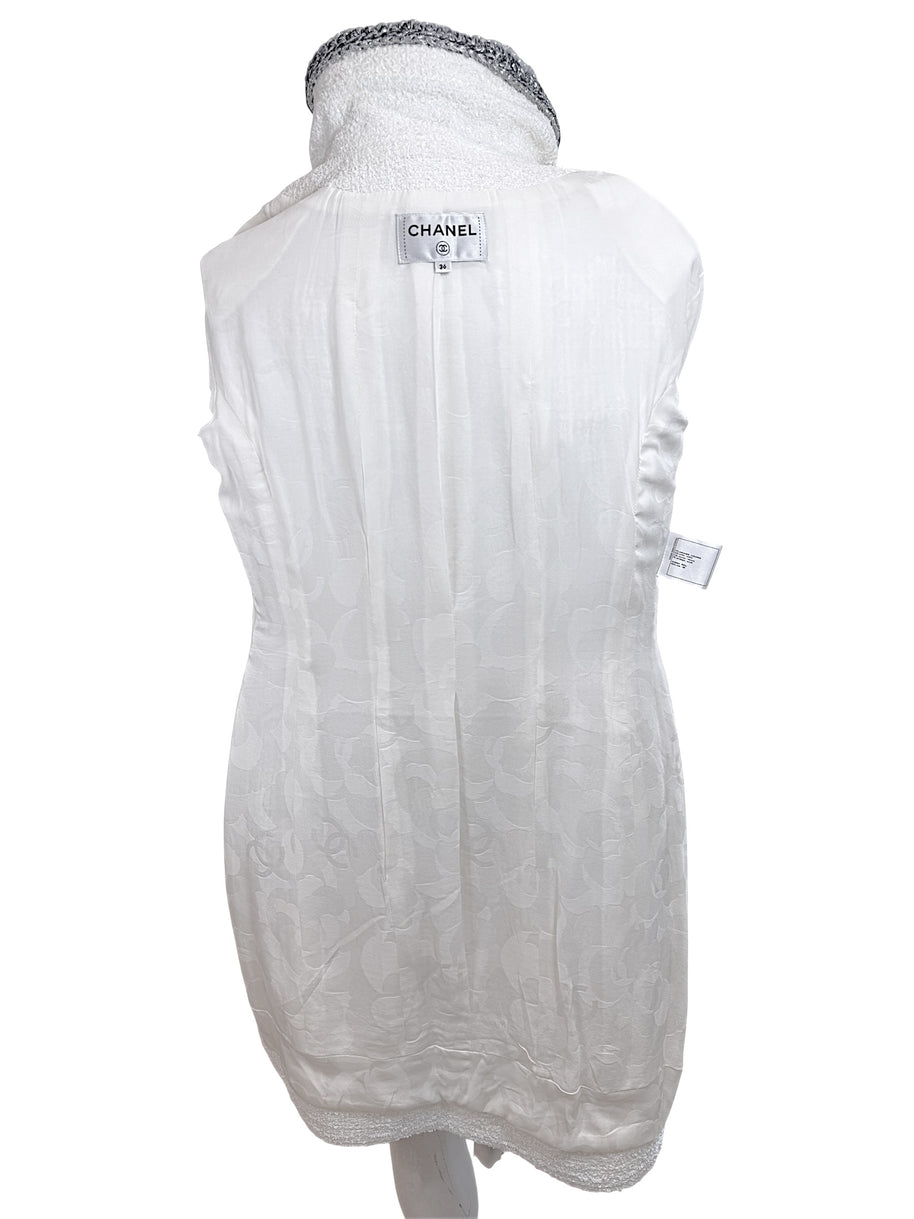 Full interior view of Chanel white bouclé tweed dress with signature silk CC jacquard lining and label detail
