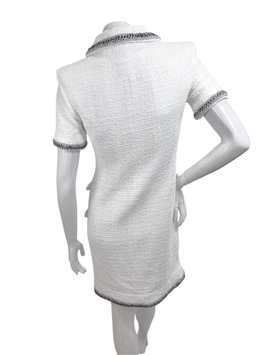 Back view of authentic Chanel white bouclé tweed dress with structured tailoring and metallic trim accents