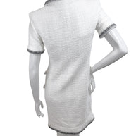 Back view of authentic Chanel white bouclé tweed dress with structured tailoring and metallic trim accents