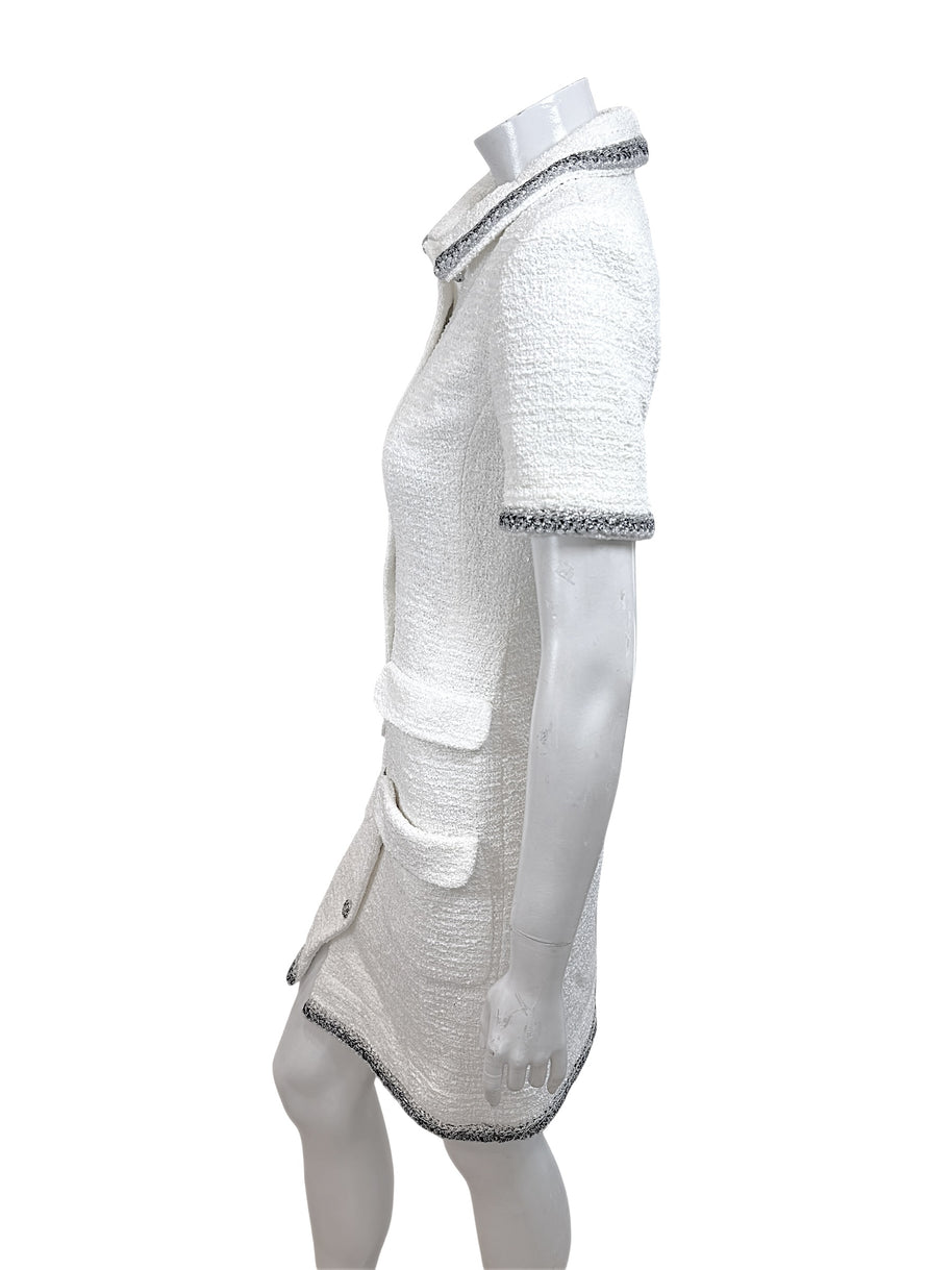Side profile view of Chanel white bouclé tweed dress with tailored silhouette and metallic trim detailing