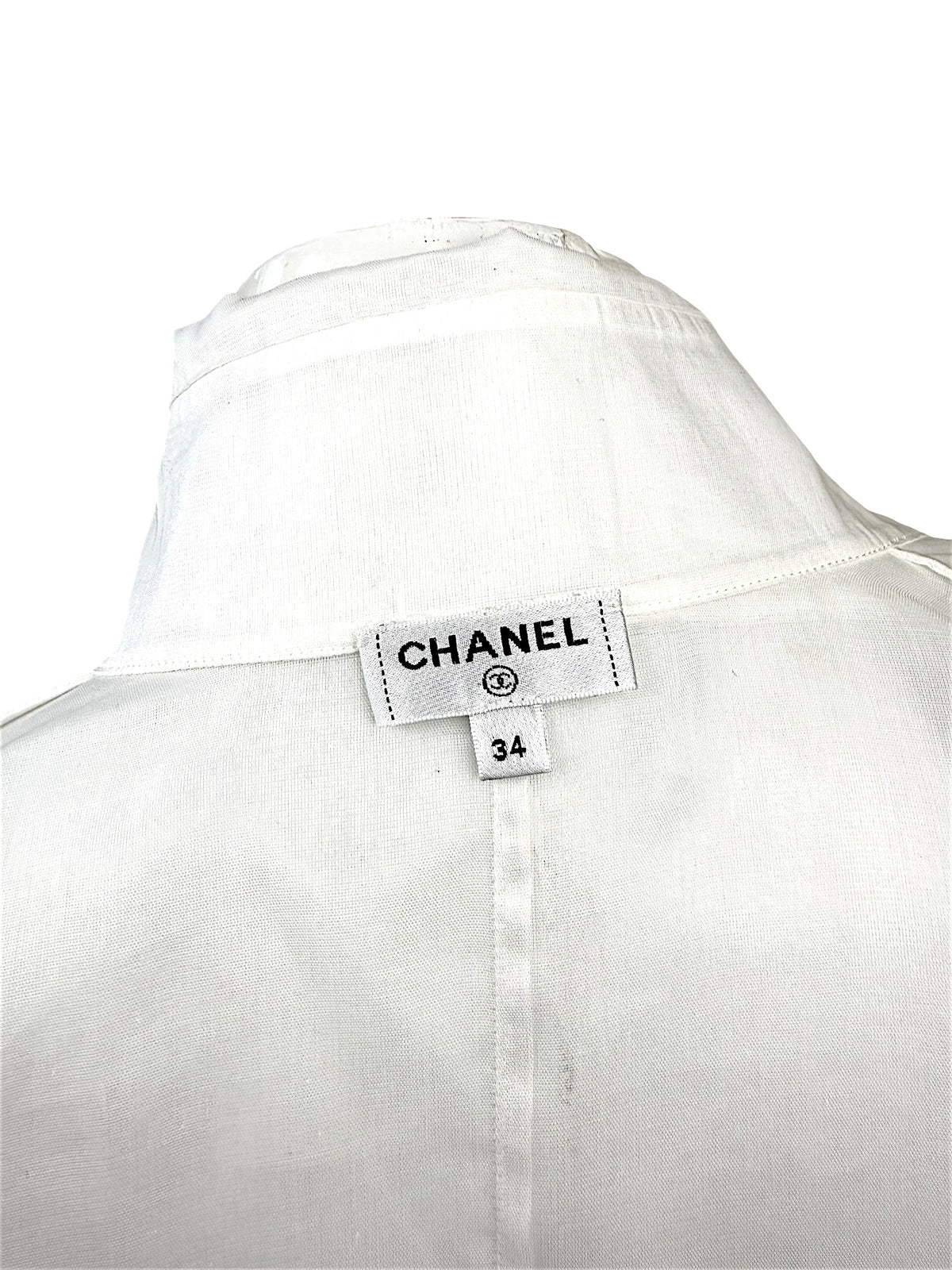 Chanel white silk tuxedo blouse interior Chanel label and neckline detail