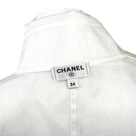 Chanel white silk tuxedo blouse interior Chanel label and neckline detail