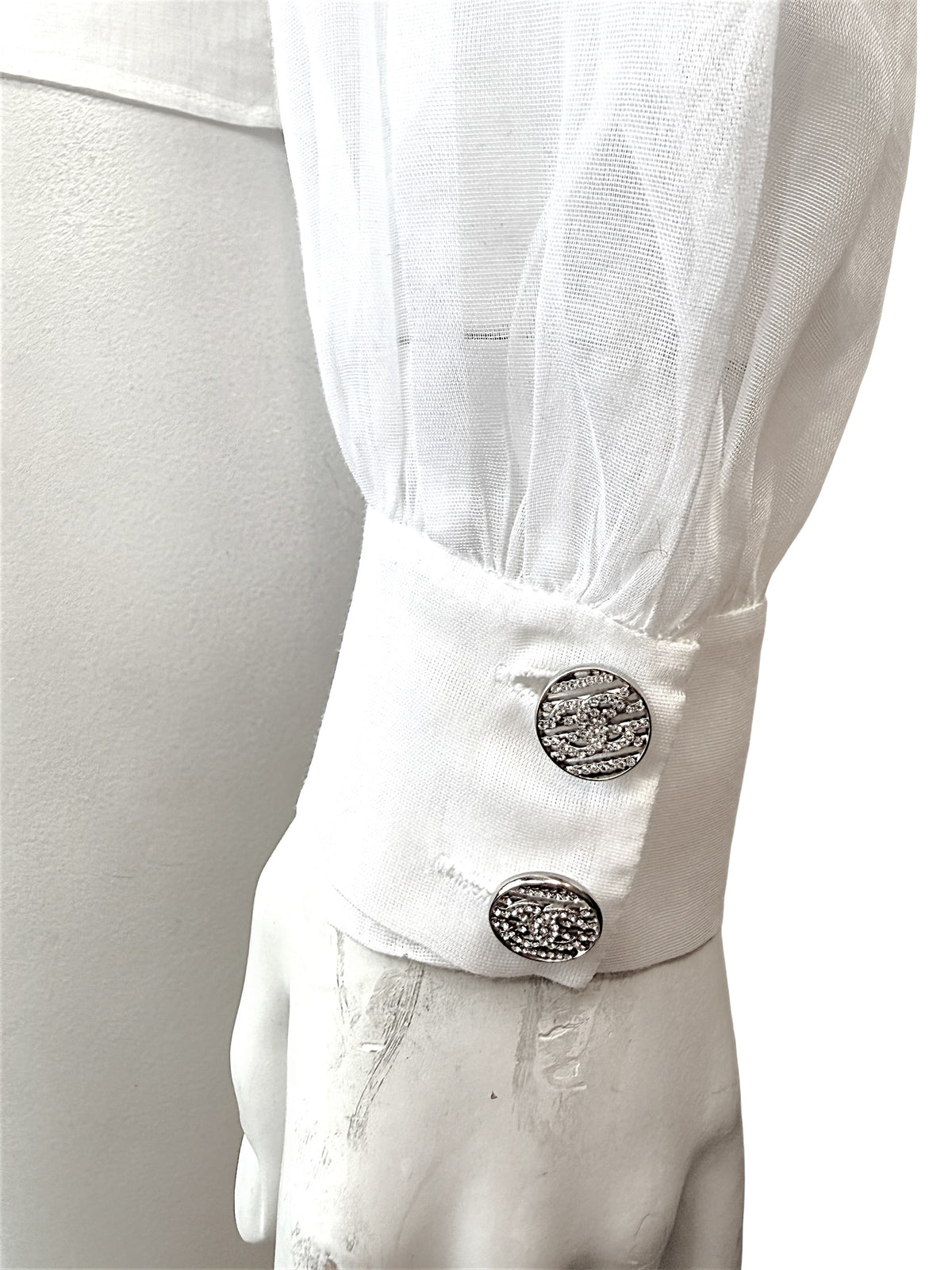 Chanel white silk tuxedo blouse cuff with jeweled CC button detail