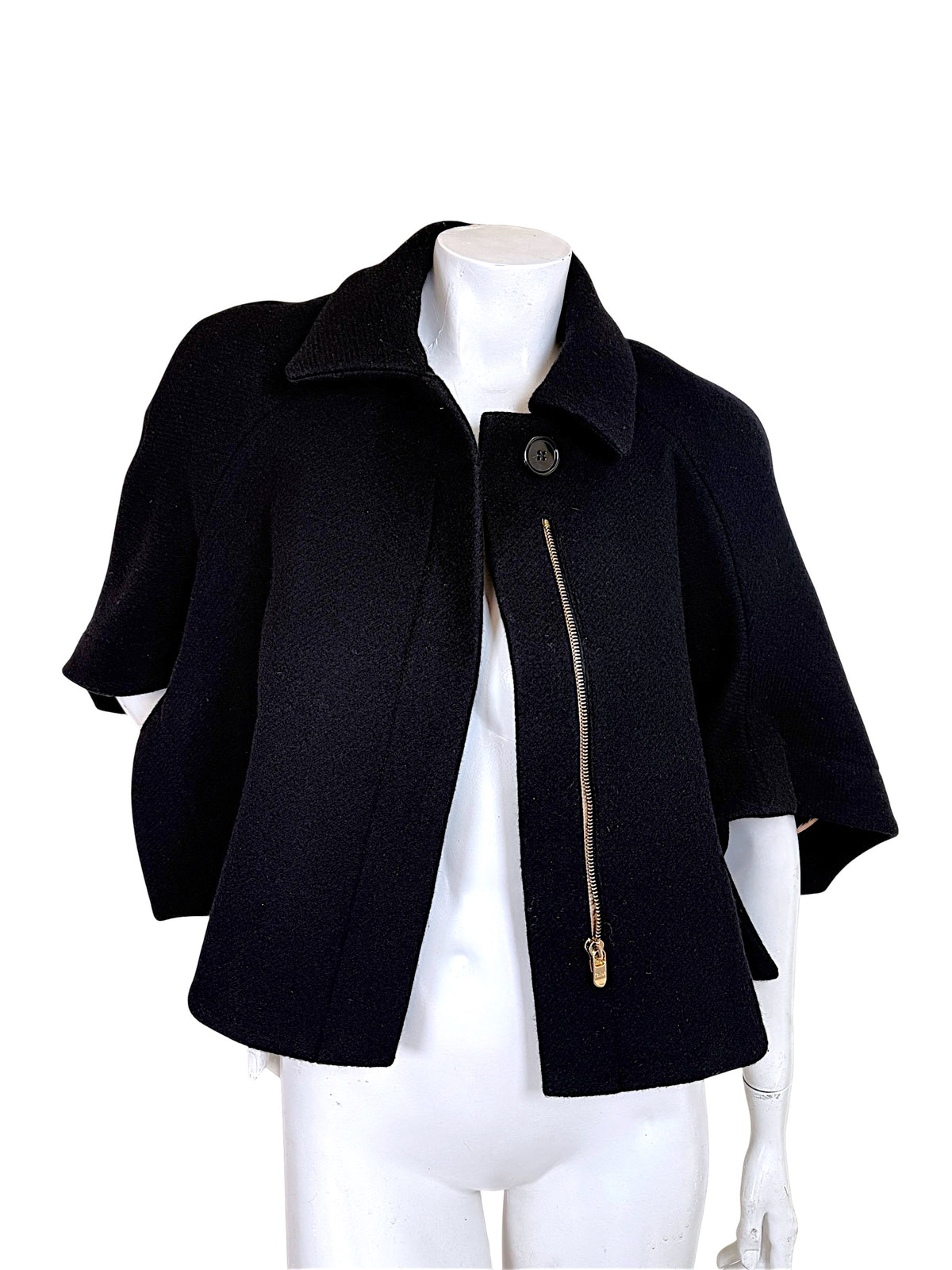 Chloé black wool cropped cape jacket from Fall 2013 shown open with gold-tone asymmetric zipper and cape sleeves