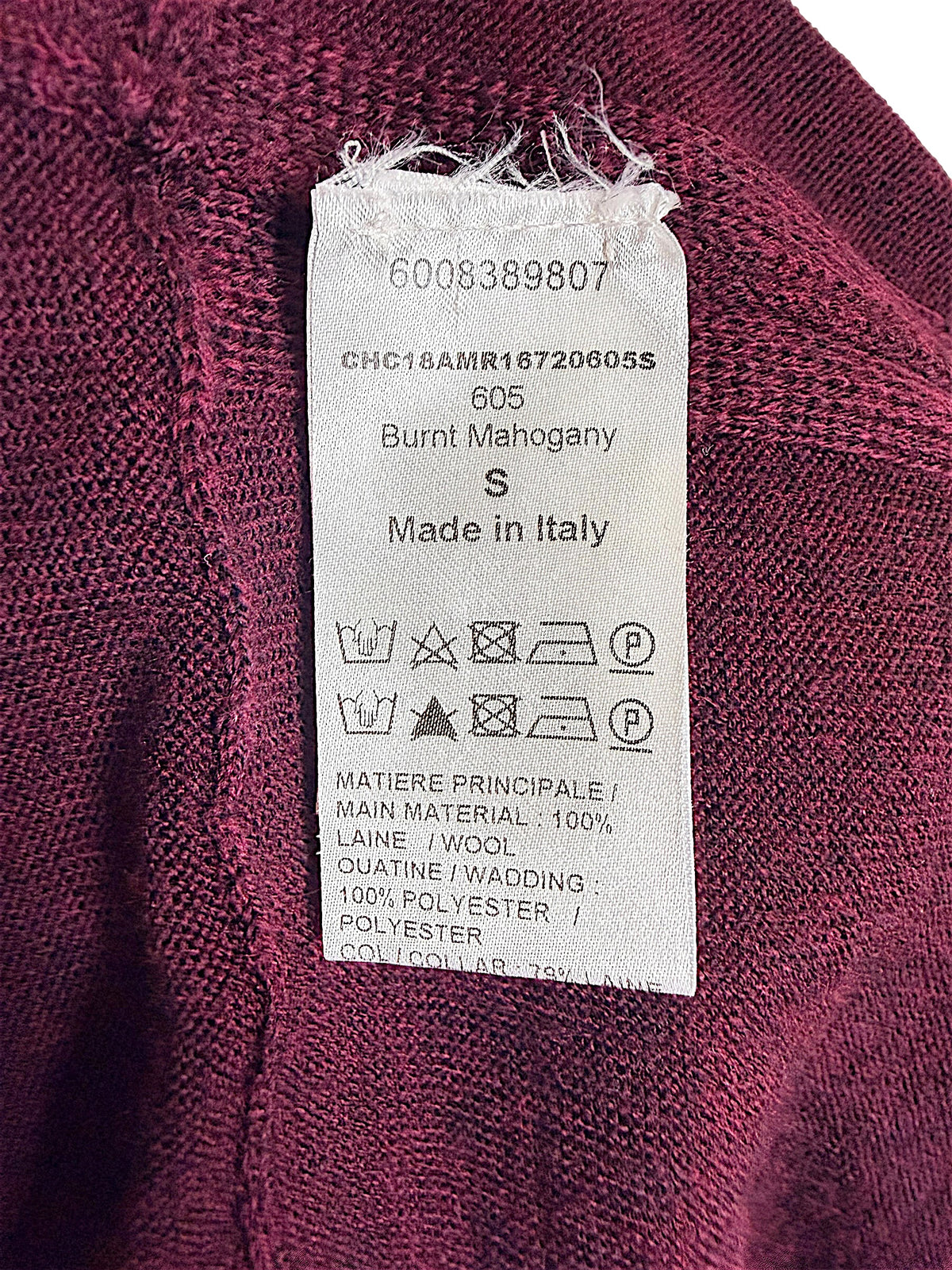 Chloé wool sweater dress interior care and composition label showing size S, Burnt Mahogany color 605, 100% wool main material and Made in Italy.