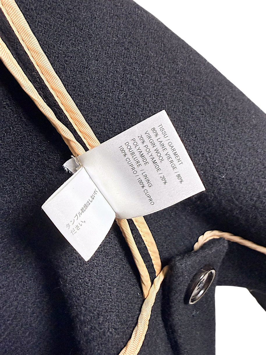 Chloé cape jacket composition label showing 80 percent virgin wool, 20 percent polyamide and cupro lining