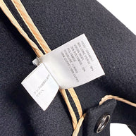 Chloé cape jacket composition label showing 80 percent virgin wool, 20 percent polyamide and cupro lining