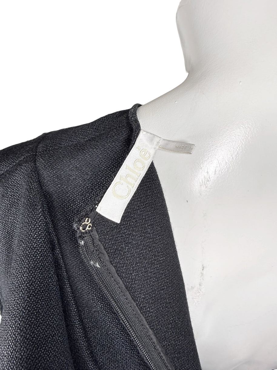 Chloé black silk wool ruffle dress interior showing Chloé designer label and back zipper detail