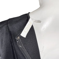 Chloé black silk wool ruffle dress interior showing Chloé designer label and back zipper detail