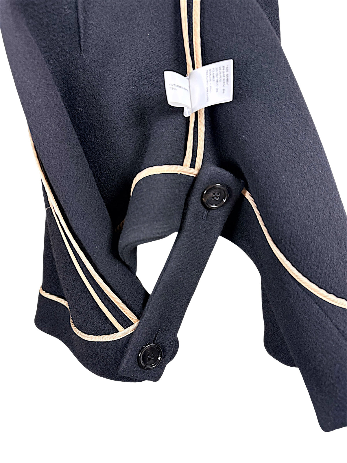 Interior button fastening and beige grosgrain finishing on Chloé Fall 2013 black wool cape jacket