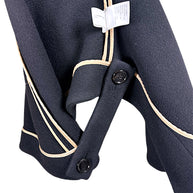 Interior button fastening and beige grosgrain finishing on Chloé Fall 2013 black wool cape jacket