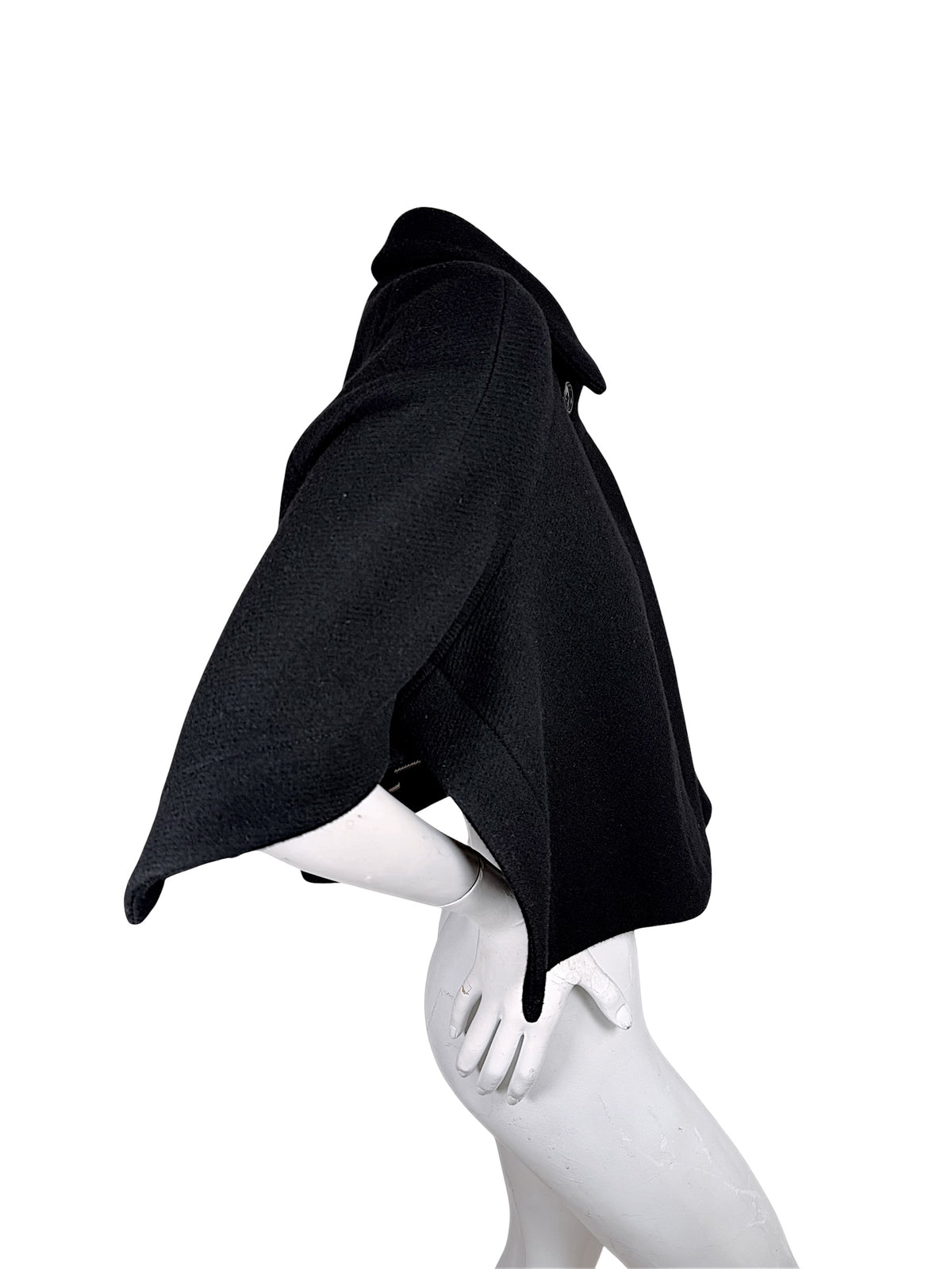 Side view of Chloé black virgin wool cropped cape jacket FR 36 showing flared sculptural sleeve silhouette