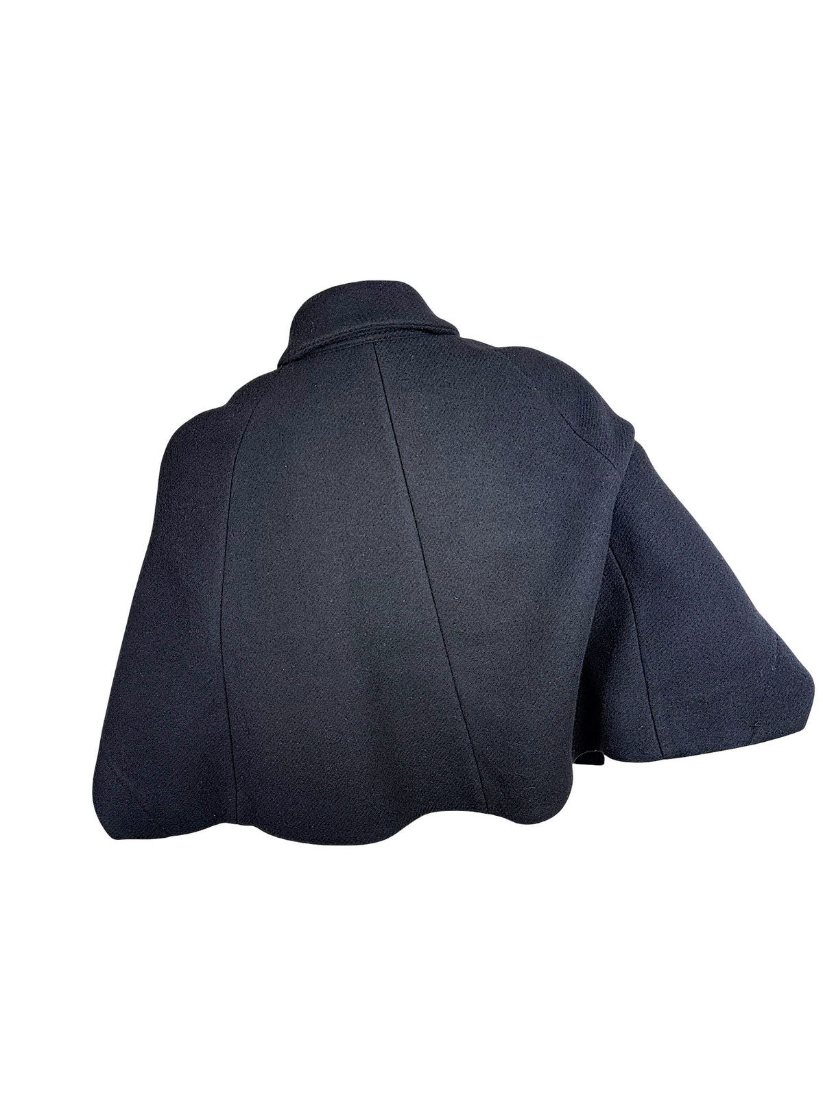Back view of Chloé Fall 2013 black wool cropped cape jacket showing curved panel seams and flared hem