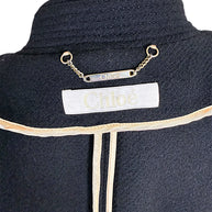 Chloé designer label and gold-tone chain plaque inside Fall 2013 black wool cropped cape jacket