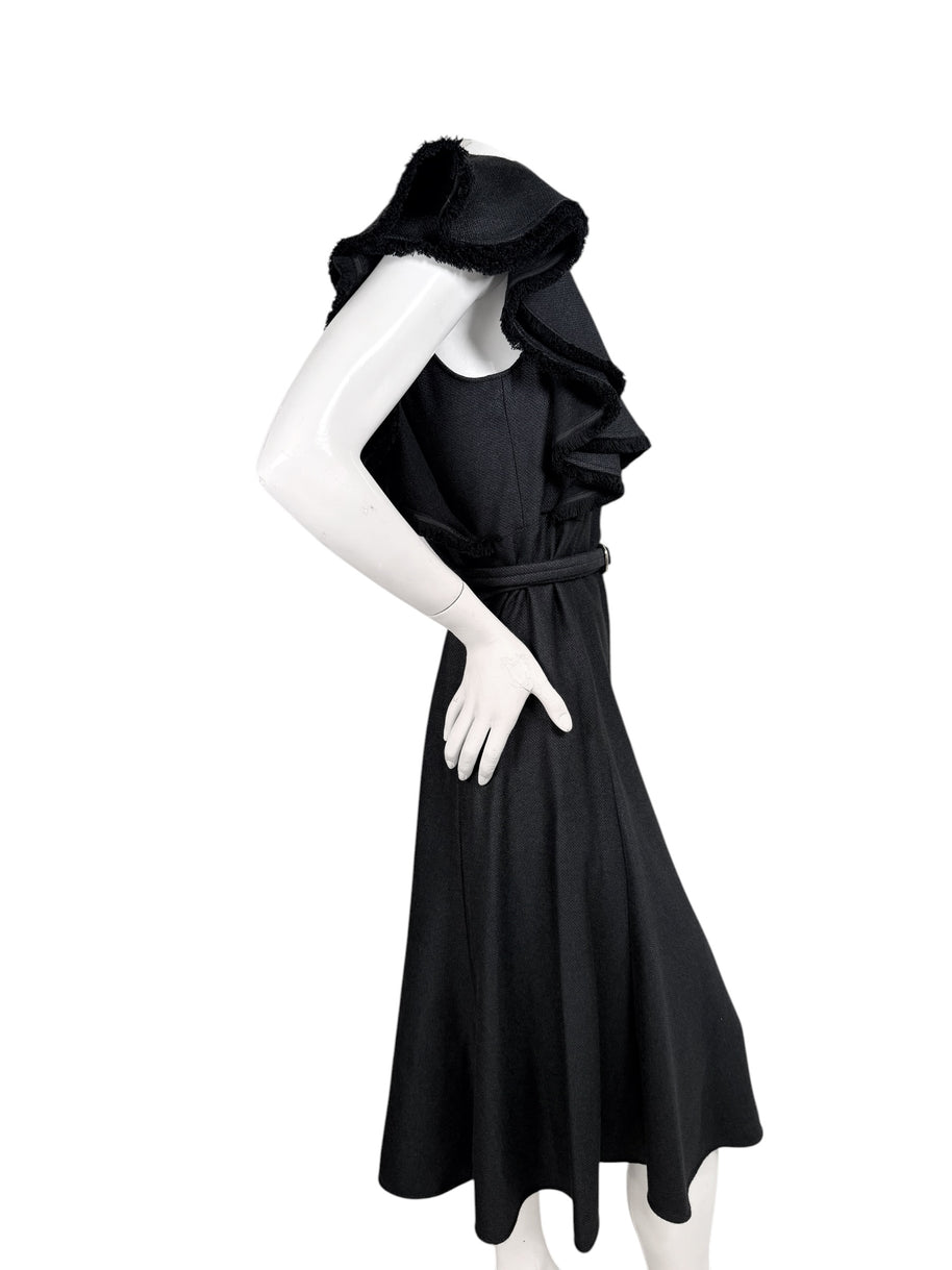 Chloé Fall 2022 black midi dress with layered cape ruffle sleeves and fringed trim, side view