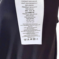 Christopher Esber black maxi dress composition and care label showing cotton and viscose fabrication