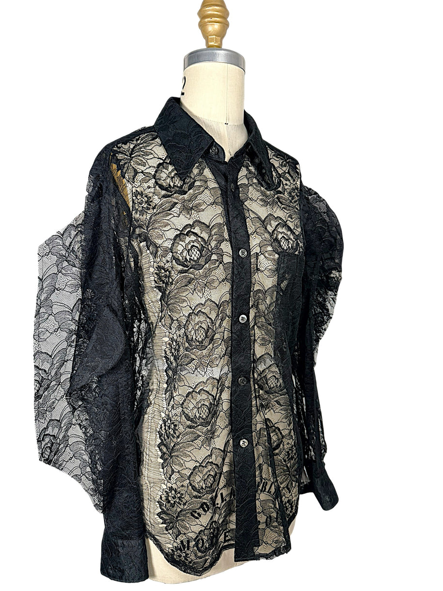 Angled front view of Comme des Garçons black floral lace shirt featuring sheer botanical lace, button-front closure and long sleeves.