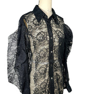 Angled front view of Comme des Garçons black floral lace shirt featuring sheer botanical lace, button-front closure and long sleeves.