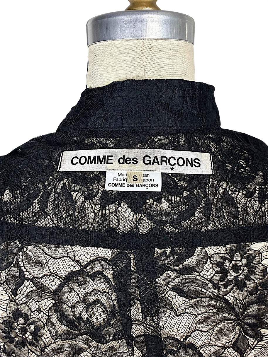 Close-up of original Comme des Garçons mainline designer label and size S tag sewn inside black floral lace shirt, made in Japan.