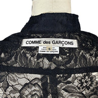 Close-up of original Comme des Garçons mainline designer label and size S tag sewn inside black floral lace shirt, made in Japan.