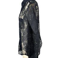 Opposite side view of Comme des Garçons black lace shirt highlighting sheer floral sleeve, pointed collar and relaxed fit.