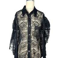 Comme des Garçons black sheer floral lace button-down shirt, front view on a US size 2 dress form showing floral pattern, collar and chest pocket.