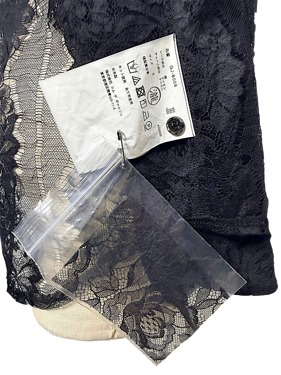 Comme des Garçons black floral lace shirt with Japanese garment care label, style code GJ-B008 and accompanying spare lace fabric.
