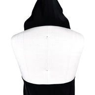 Courrèges Fall 2024 Ready-to-Wear Look 23 black Oblique Space hooded mini dress, close-up rear view highlighting sculptural pointed hood and open-back construction.