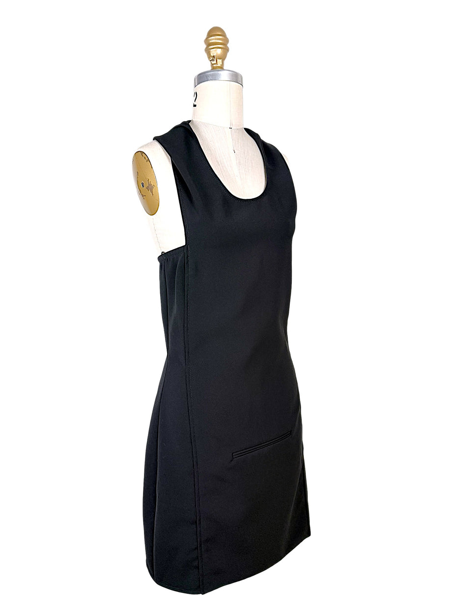 Three-quarter front view of Courrèges Fall 2024 black Oblique Space sleeveless mini dress showing fitted silhouette, scoop neckline and tailored side seams.