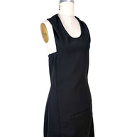 Three-quarter front view of Courrèges Fall 2024 black Oblique Space sleeveless mini dress showing fitted silhouette, scoop neckline and tailored side seams.