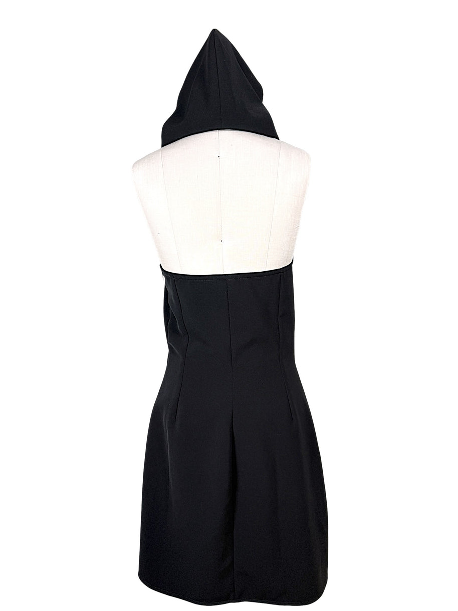 Full back view of Courrèges Fall 2024 Look 23 black Oblique Space mini dress with sculptural hood raised, open upper back and contoured skirt seams.