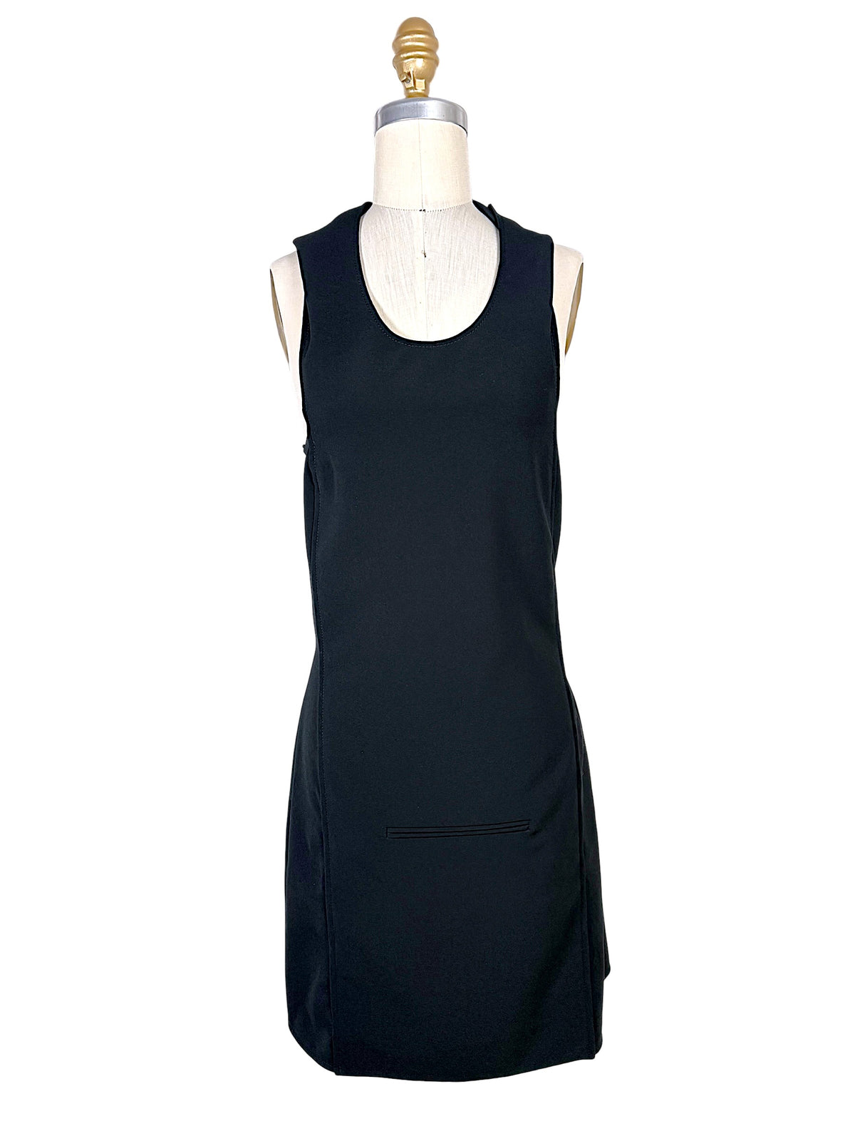 Front view of Courrèges Fall 2024 Look 23 black Oblique Space mini dress with scoop neckline, sleeveless silhouette and front welt pocket detail, FR 36.
