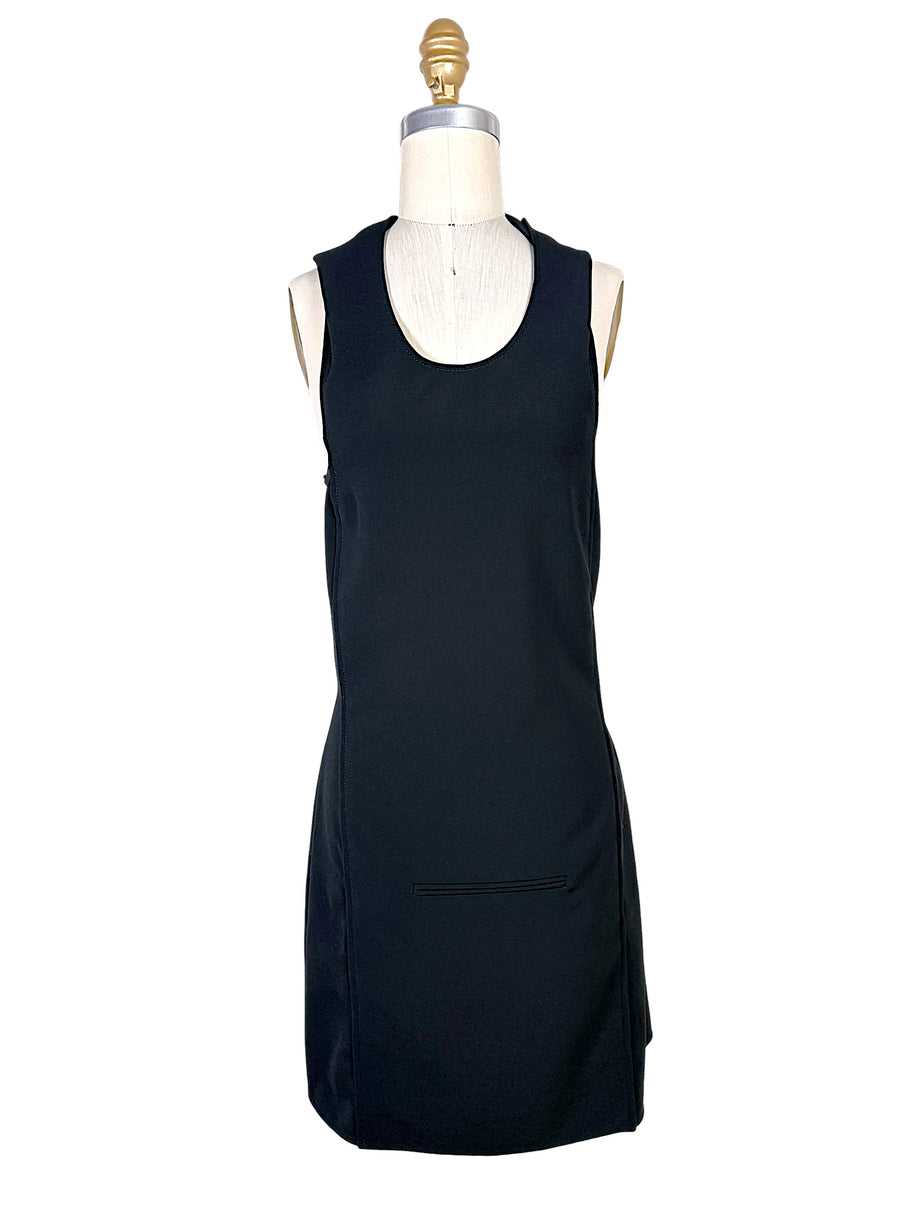 Front view of Courrèges Fall 2024 Look 23 black Oblique Space mini dress with scoop neckline, sleeveless silhouette and front welt pocket detail, FR 36.