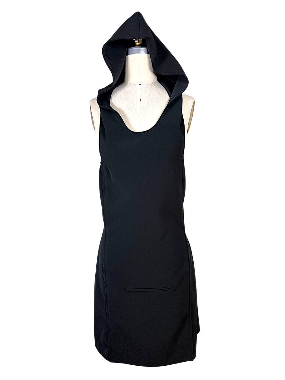 Courrèges Fall 2024 Look 23 black Oblique Space mini dress shown with its oversized sculptural hood raised, front view on a US size 2 dress form.