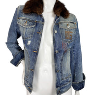 Vintage Dolce & Gabbana blue distressed denim jacket worn open, featuring a plush brown fur collar, embroidered chest detail, and fitted silhouette.