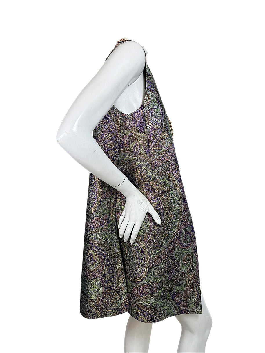Side profile of Etro women's longline paisley jacquard vest showing sleeveless silhouette, metallic woven fabric and elongated hem.